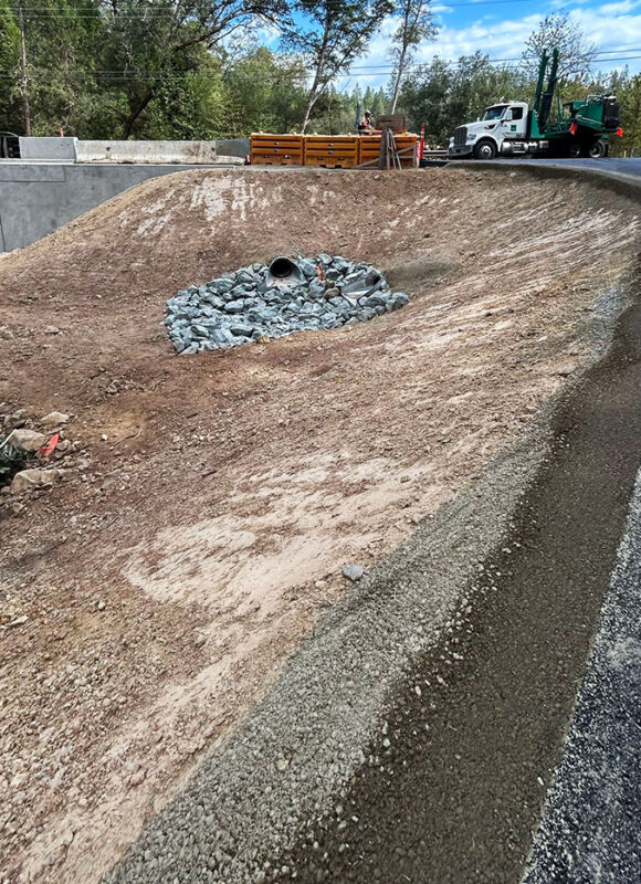 Roadside drainage and riprap erosion control installation by VEK Construction — protecting roadway from stormwater damage in Sacramento County.