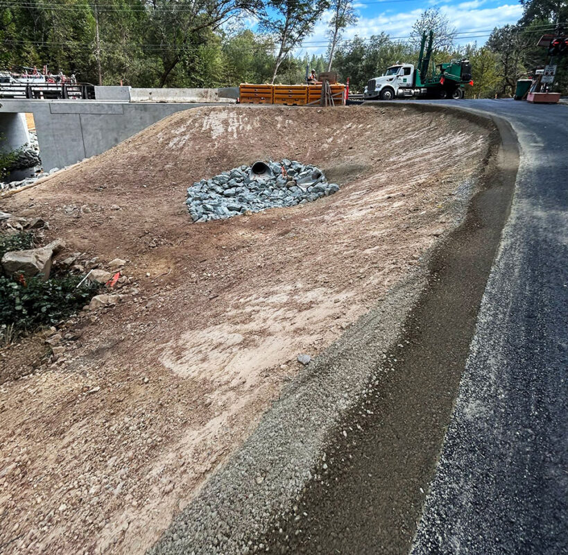 Roadside drainage and riprap erosion control installation by VEK Construction — protecting roadway from stormwater damage in Sacramento County.