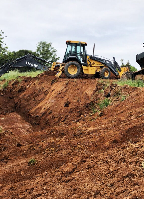 John Deere excavators and dozer performing site grading and slope excavation for residential development — VEK Construction Sacramento.
