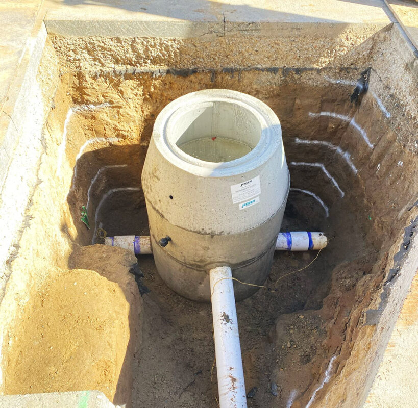 Concrete catch basin and storm drain system installation by VEK Construction — expert underground utility and drainage work in Sacramento.